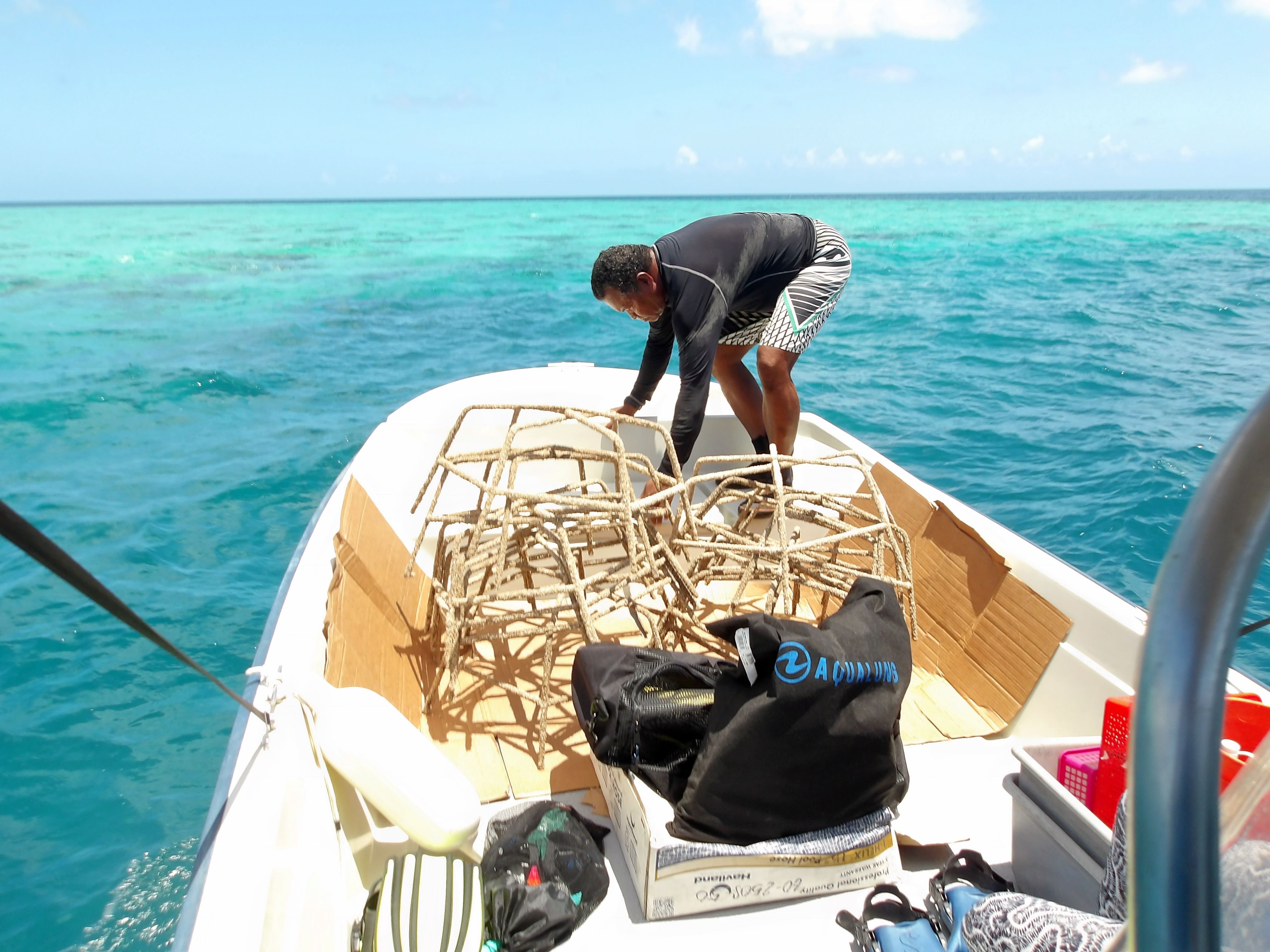 Palau Coral Champion unloads coral reef nursery structures at nursery site in Palau.